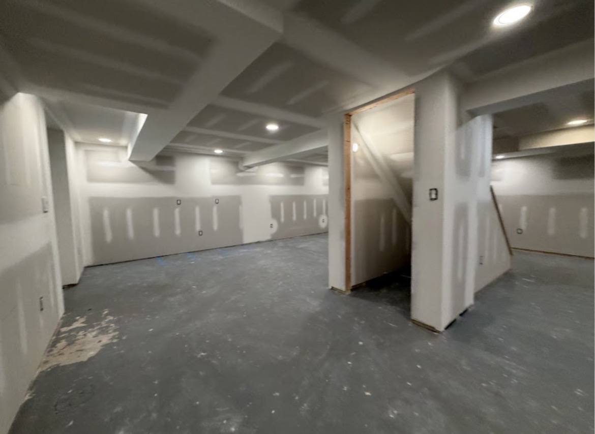 Open basement with completed drywall installation