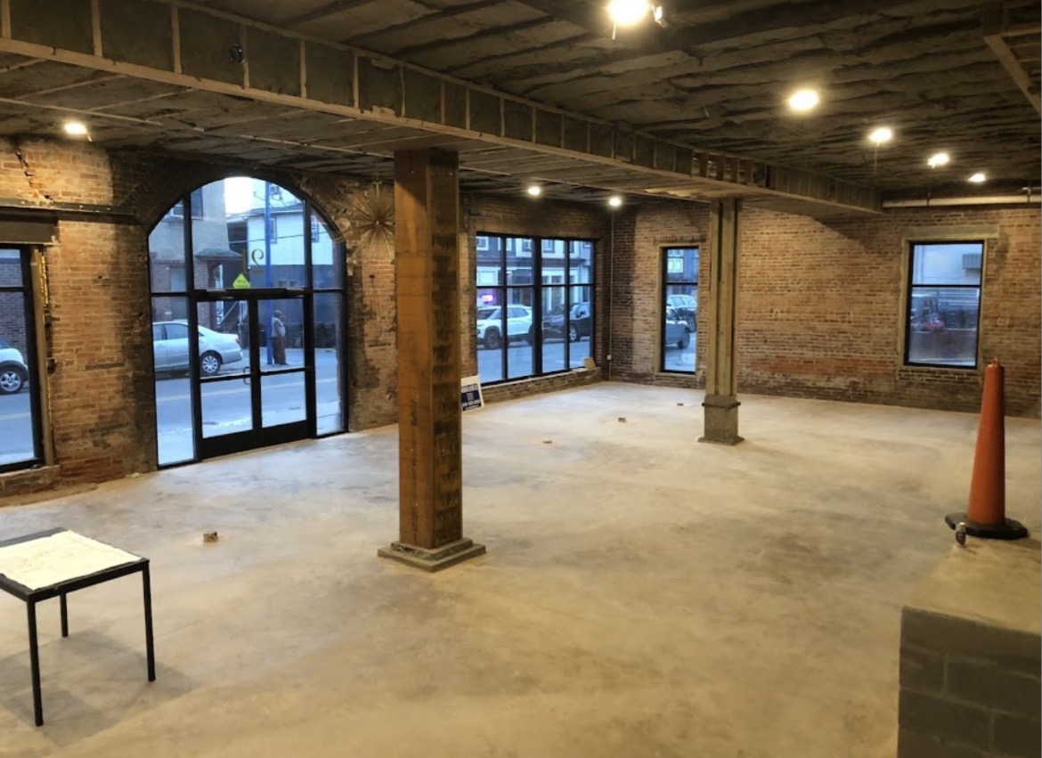 Storefront interior remodel with exposed brick