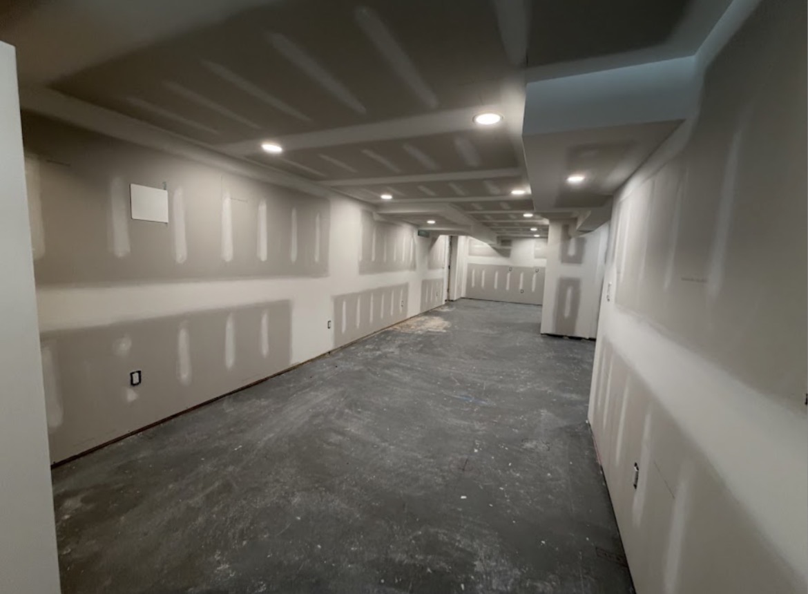 Smooth taped and finished basement walls